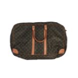 A Louis Vuitton Sirius 55 travel bag in monogram canvas, double zip compartment with classic tan