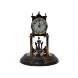 An early 20th century German brass anniversary clock, by Jahresuhren Fabrik, under a glass dome