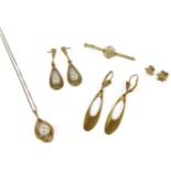 A gold single cultured pearl drop pendant, marked 14k, on chain, marked 14k, and a matched pair of