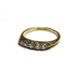 A gold boat shaped five stone diamond ring, marked 18ct and plat, 2.95g