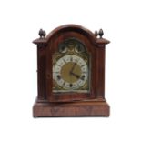 An early 20th century German walnut bracket clock, with three train quarter striking movement with 5