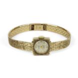 A ladies 9ct gold Bersay mechanical textured bracelet watch, with silvered dial and Arabic numerals,
