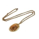 A back and front oval locket on gold belcher chain, tested as 9ct