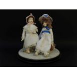 Two Royal Doulton Nisbet dolls, the largest 29cm tall