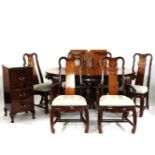 A modern Chinese style hardwood dining table and six chairs, the table measuring 238cm when fully