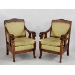 A pair of Dutch colonial armchairs, with striped backs and seats