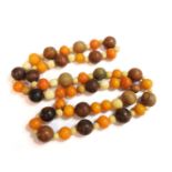 A single row of uniformed circular amber beads, graduated ivory beads and hardwood bead necklace, c.