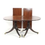 A reproduction mahogany twin pedestal dining table