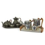 A Piquot ware four piece tea set, on a tray, and another four piece 'Unity' pewter tea set, on a