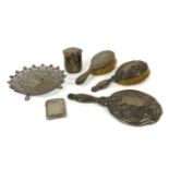 A silver backed hand mirror and brush embossed with flowers, 28.5cm, another brush, a pot and cover,
