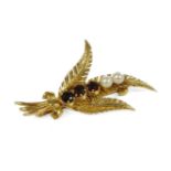 A gold cultured pearl and garnet set leaf spray brooch