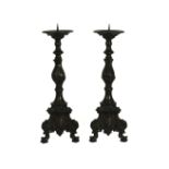 A pair of cast pricket candlesticks, 40.5cm high