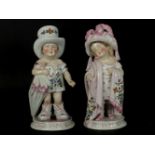 A pair of Victorian pottery figures of children dressed in adult clothes, titled 'Mama and Papa',