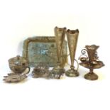A collection of Indian white metal items, comprising a pair of bud vases on tray, a small cup and