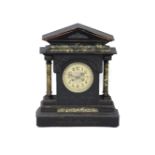 A Victorian grained wooden 'marble effect' mantel clock with striking movement, 57cm high