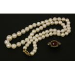 A single row of graduated pearls, 6-9.2mm graduating with 9ct gold clasp, and 9ct gold three