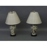 A pair of modern vase table lamps, decorated with leave, each with a pleated shade