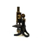 A lacquered brass microscope, inscribed J Swift & Son, London