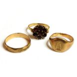 A 9ct gold wedding ring, a 9ct gold signet ring, and a gold garnet cluster ring, marked 9ct