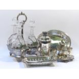 A silver plated triple decanter, the glass decanters each fitted with spirit labels, 36cm high,
