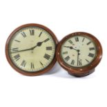 A mahogany cased wall clock, the painted dial flaking, 40cm diameter, and a L.C.C. clock dial, and