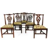 A set of four 19th century Chippendale design dining chairs, with pierced splat above drop in seats,