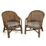 A pair of rattan chairs