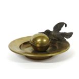 An inkwell, modelled as a cold painted kingfisher perched on the side of a dish, the inkwell an egg,