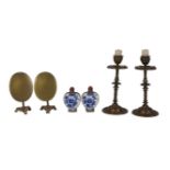 A pair of cast brass candlesticks, initialled JCS, a pair of miniature brass loo tables and a pair