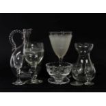 A collection of mixed clear glassware, wine glasses, cut glass vases, decanters, etc