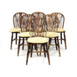 A set of six wheel back kitchen chairs