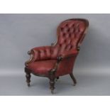 A Victorian burgundy upholstered armchair