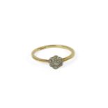 A gold diamond daisy cluster ring, marked 18ct