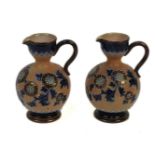 A pair of Royal Doulton jugs, 14cm high