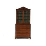 An Edwardian satin walnut secretaire bookcase, with a pair of astragal glazed doors over a fitted