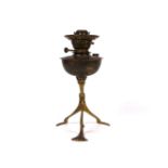 In the manner of W.A.S. Benson, a copper and brass oil lamp, 32cm high