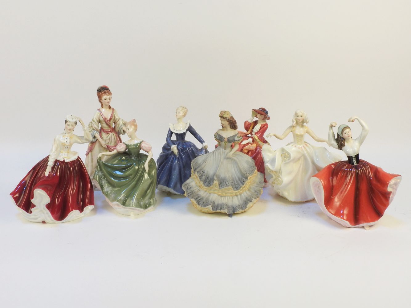 A Royal Doulton, figure 'Top O The Hill', HN1834, and a collection of six other similar