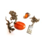 A silver amber cabochon ring, a silver ingot pendent by Jack Spencer, 1981, on chain, a banded agate