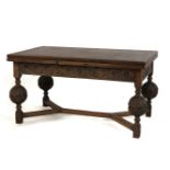 A Tudor style carved oak draw leaf dining table with bulbous legs. 274cm long (open) x 91cm wide x