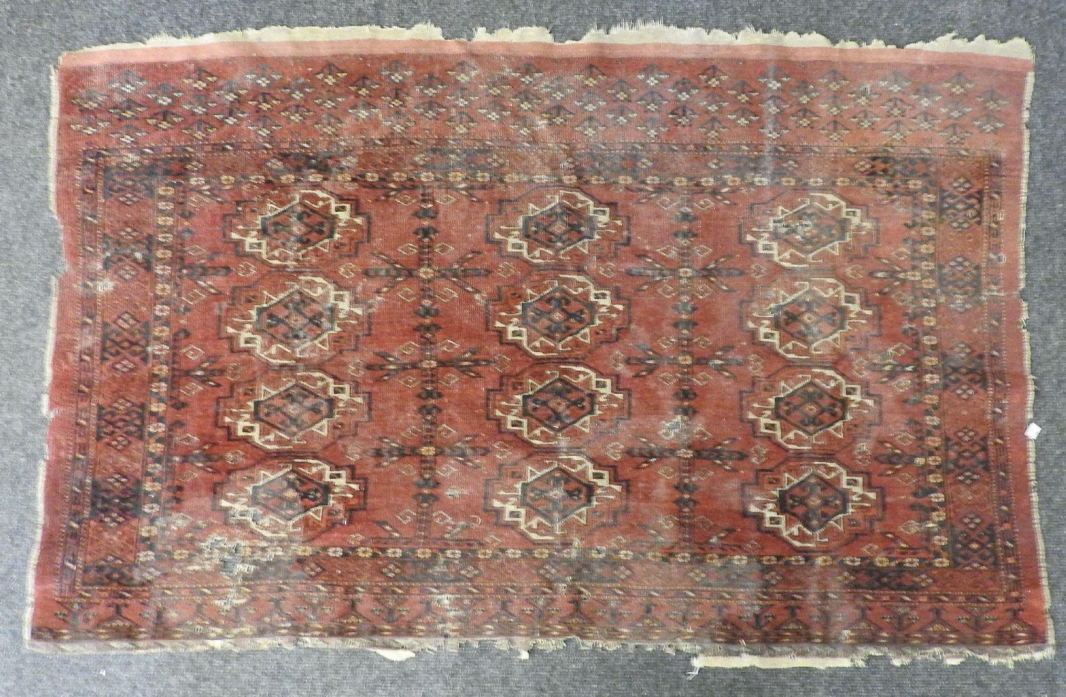 A Bokhara rug, the red fields with repeated geometric decoration and one other similar (both AF) - Image 3 of 4