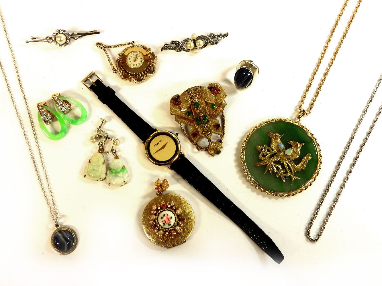A quantity of costume jewellery, to include a Victorian gilt metal brooch, set with pink and green
