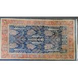 A large Indo Chakhari carpet, the blue ground with stylized garden design, within a multiple