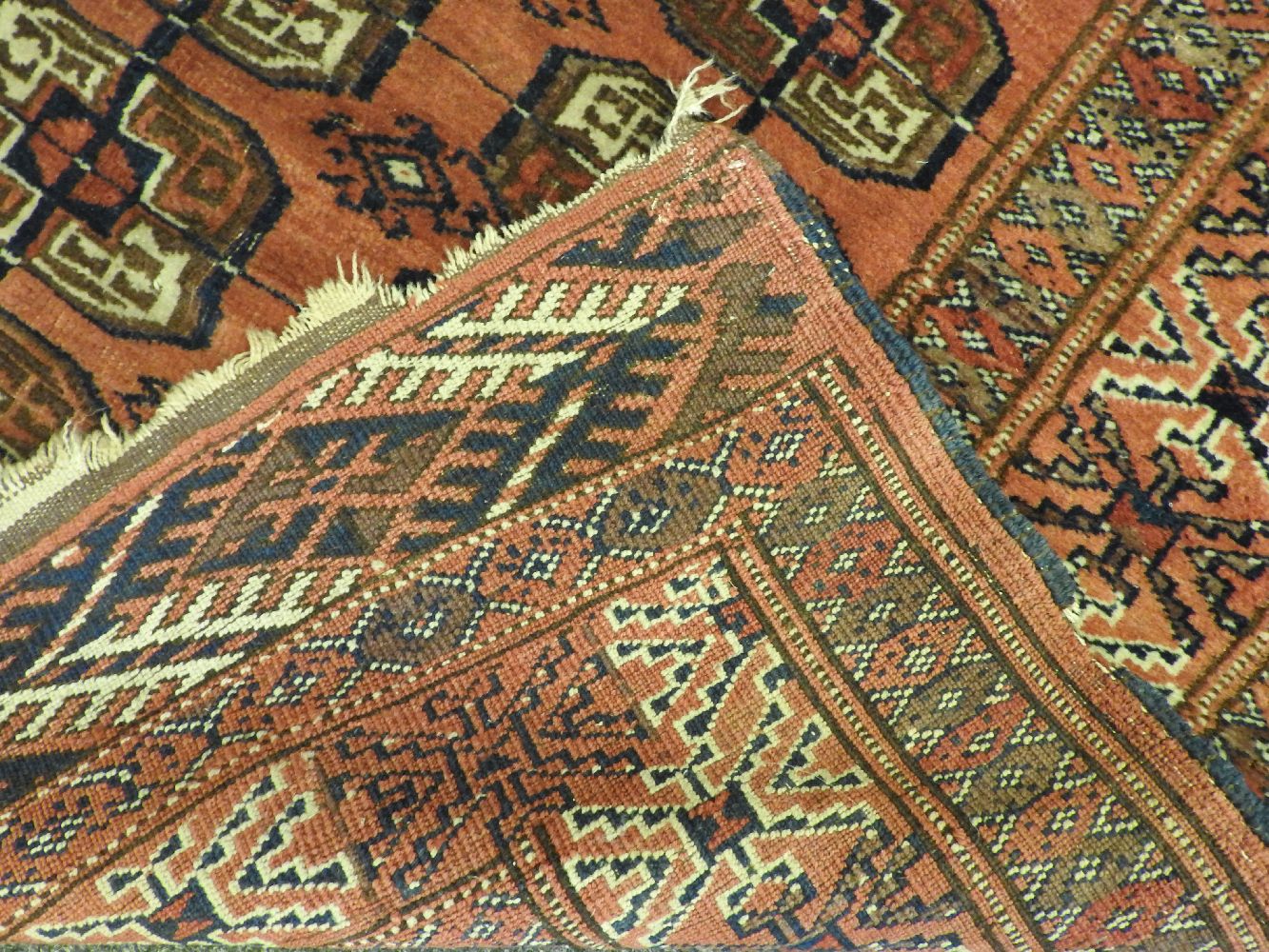 A Bokhara rug, the red fields with repeated geometric decoration and one other similar (both AF) - Image 2 of 4