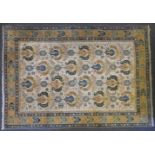 A cream ground Caucasian carpet, the central field with latch hook and gul design, 277cm x 208cm