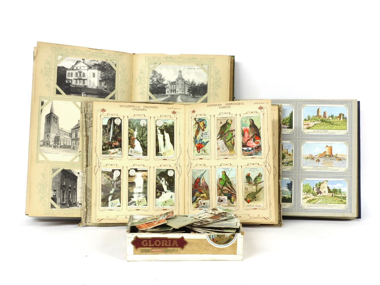 A Belgian postcard album and postcards, an album of Tobler & Co cards and loose cards.