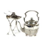 A silver plated spirit kettle, stand and burner, of ovoid form with reeded detail, the teapot with