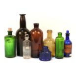 A quantity of old bottles to include, a mallet shaped wine bottle, chemists, and pharmacy bottles