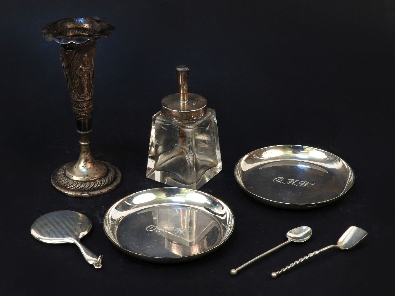 Silver items: two modern circular dishes, dolls mirror, two cruet spoons, small eastern specimen