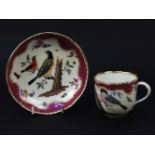 A Meissen cup and saucer, painted with birds on tree stumps, flowers and insects, gilt highlights