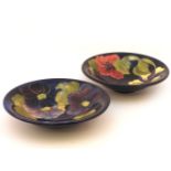 Two Moorcroft Hibiscus and Anemone bowls, green initials, 25cm diameter